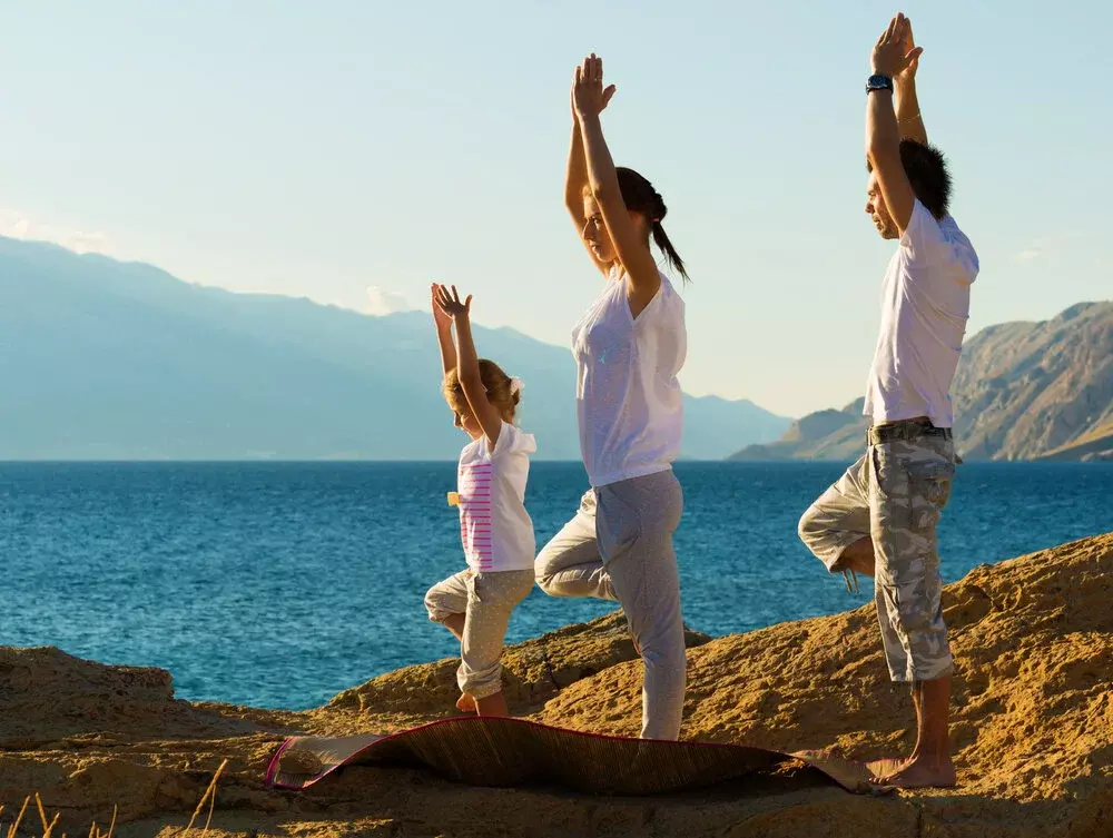 Couple Yoga Pose with Baby