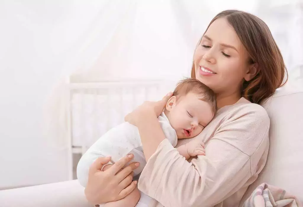 Mother & Her Child Sitting on the Bed