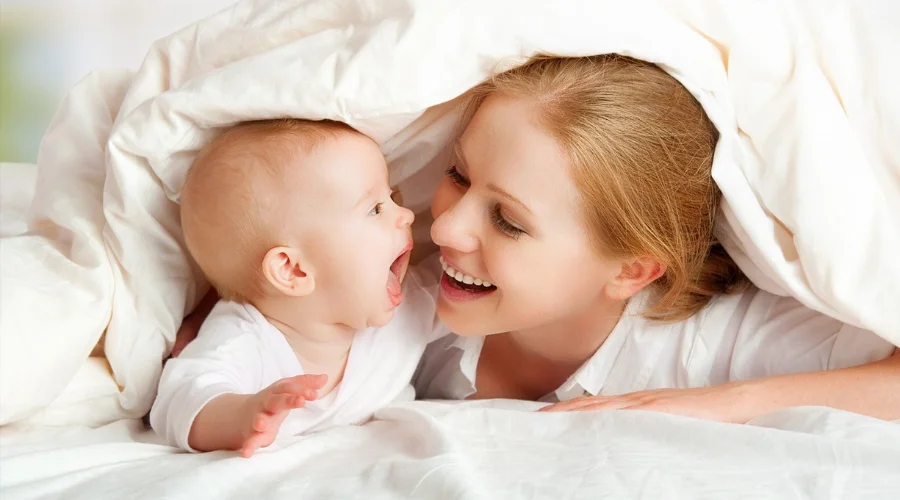 Mom Cuddling Her Newborn Kid