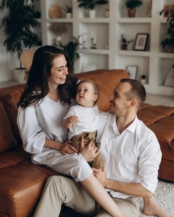 Cute Family Pose On The Sofa